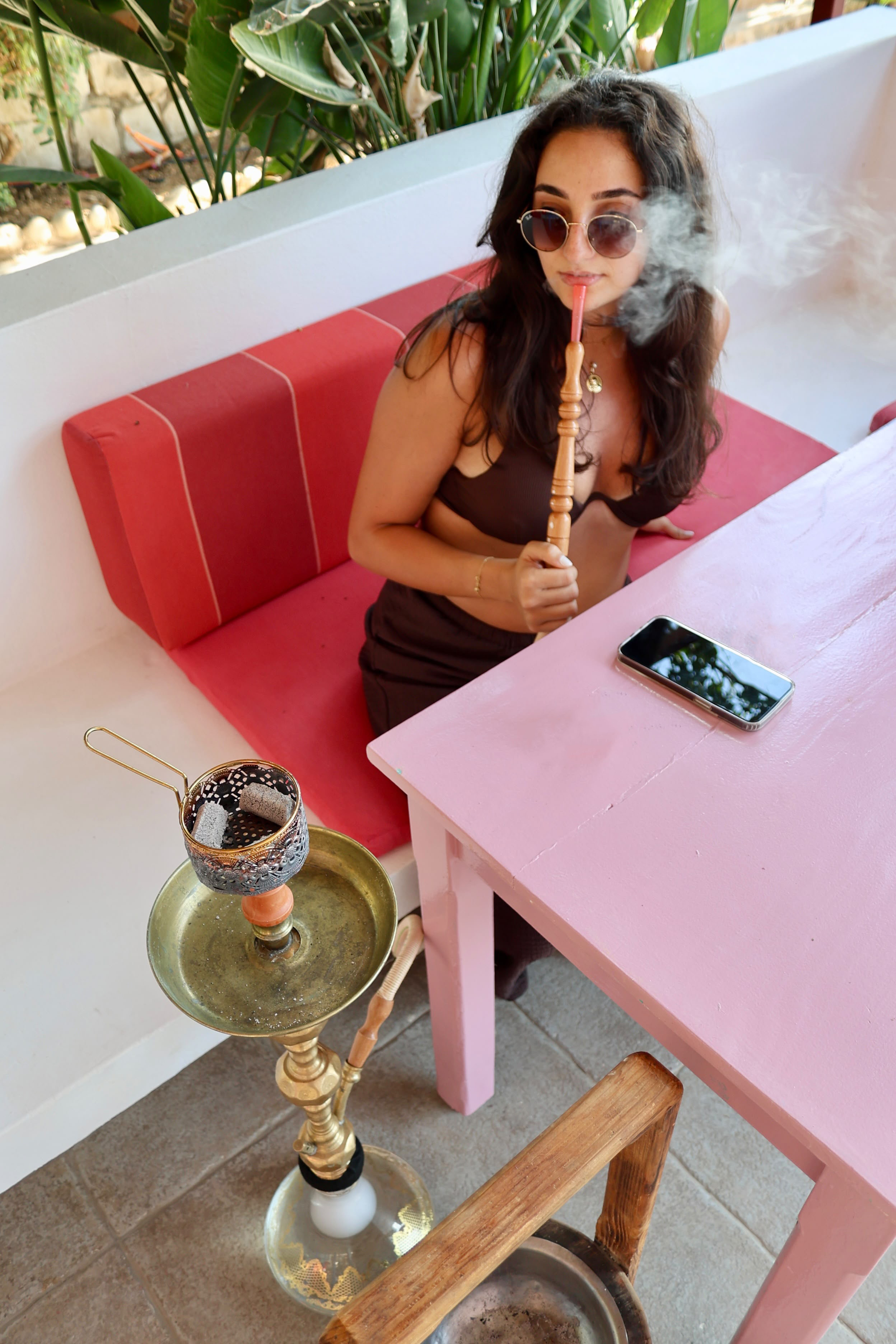 Guest enjoying shisha at Side B Beach Club